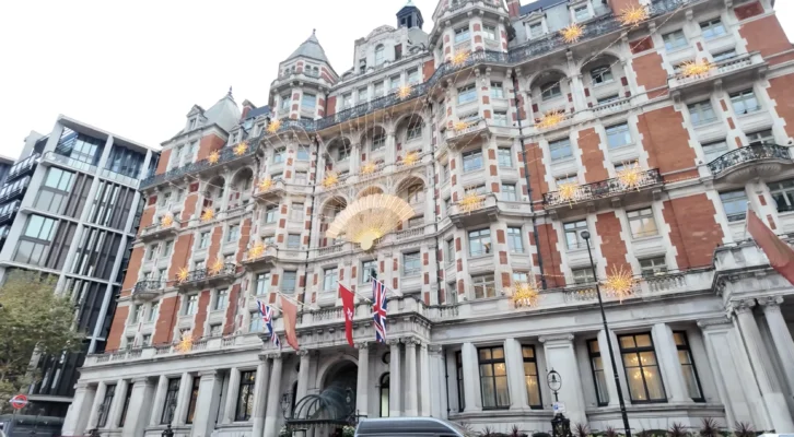 Mandarin Oriental London Exterior Red Brick Facade Golden Star Lights British Flags