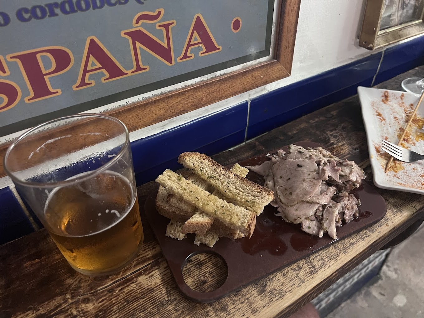 La Tranca bar in Málaga with vermouth barrels and chalkboard menu