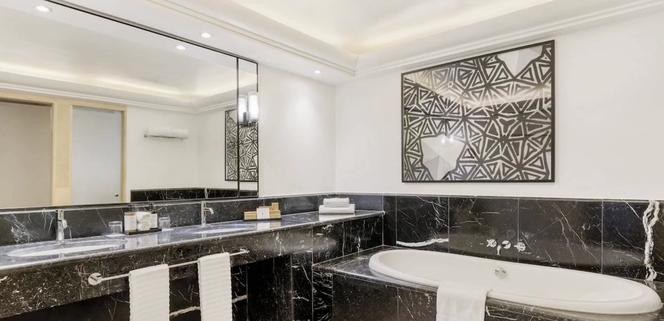 Gran Marbella Resort — marble bathroom with separate bathtub and walk-in shower