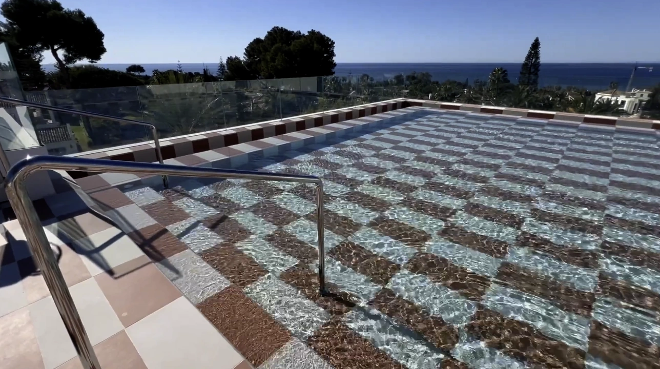 Escondido rooftop bar and pool at Kimpton Los Monteros Marbella — sunset Mediterranean views