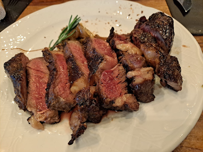 Grilled steak over charcoal at the best asador restaurant in Marbella, Costa del Sol