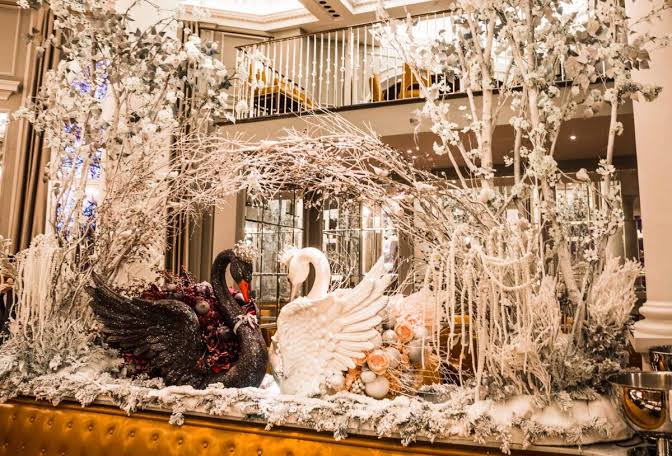 Corinthia London Whitehall lobby and chandelier decorated for Christmas