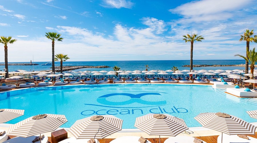 Ocean Club Marbella beach club pool with superyachts in background Puerto Banus